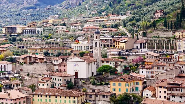 Aerial view of historic buildings with church in Italian town of Limone on Lake Garda, Italy