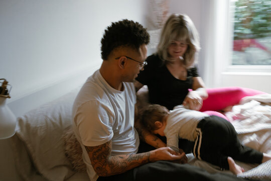 Motion blur of family and a playful child