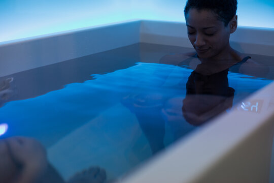 Individual experiencing a peaceful moment in spa