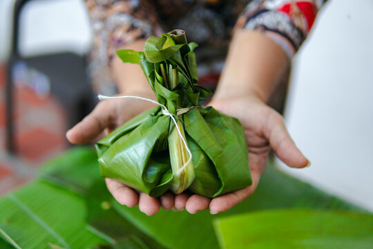 Woman holding a tamal