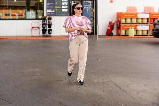 Walking Across Gas Station 