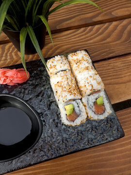 Sushi, ginger, and soya sauce on a table
