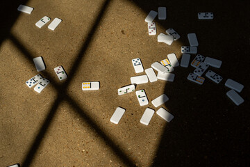 Dominoes on the floor with a golden light