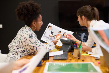 Two women review final project