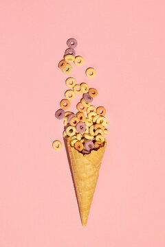 Colorful rings / loops breakfast cereal coming out of ice cream cone