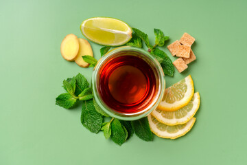 Tea composition made with lemon, ginger, mint, cane sugar, lime. Top view.