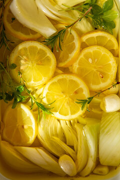 Fennel, herbs, garlic and lemon in ollive oil