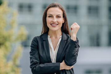 portrait of smiling businesswoman outdoors