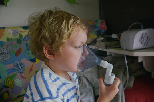 A child with nebulizer at home