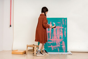 cute Artist Painting on Canvas