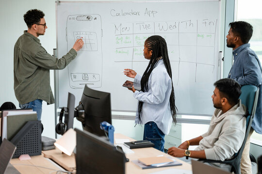A man and a woman are developing a mobile application