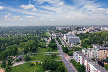 Summer skyline cityscape of Dolna Wilda district in Poznań, Poland. Wide panoramic aerial view. Park im. Św. Jana Pawła II and City tax office building (Urząd Skarbowy).
