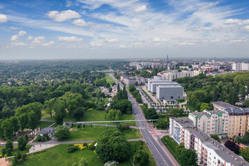 Summer skyline cityscape of Dolna Wilda district in Poznań, Poland. Wide panoramic aerial view. Park im. Św. Jana Pawła II and City tax office building (Urząd Skarbowy). © uslatar