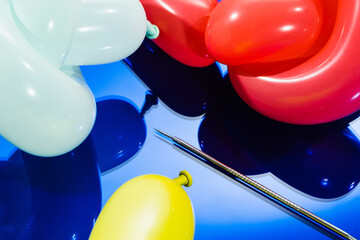 colourful balloons and needle 