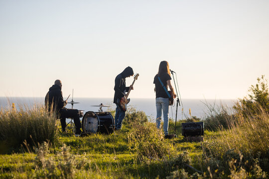 Music band rehearsing outdoors