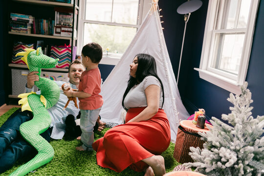 family having fun in a playroom  