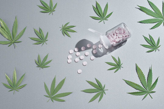 CBD pills. Group of clear CBD Cannabidiol capsules and hemp