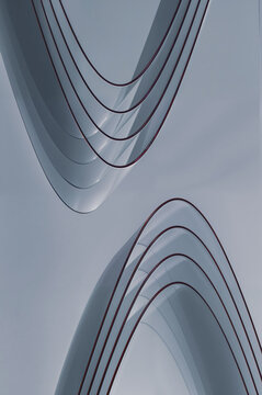 Abstract curved forms against a grey sky