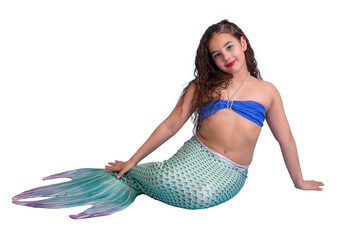 A beautiful smiling girl in a mermaid costume isolated on white background