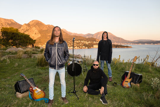Portrait of a rock band in nature