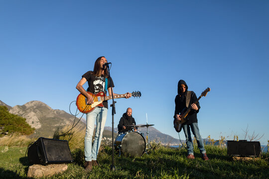Rock band plays music in nature
