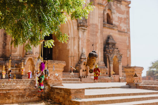 Traditional puppets hanging on tree at Bagan temple