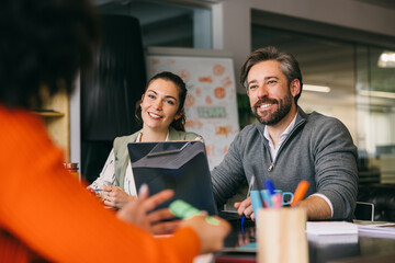 Collaborative business team in a casual office meeting