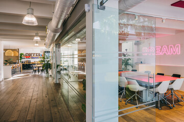 Modern office interior with vibrant Dream neon sign