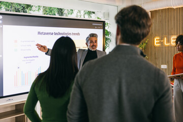 Diverse team learning about Metaverse technology trends