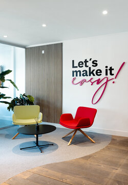 Modern office lobby with motivational wall slogan