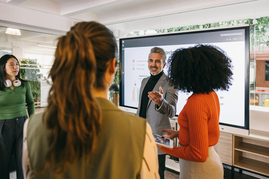 Business leader presenting to colleagues during a meeting