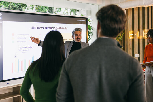 Diverse team learning about Metaverse technology trends