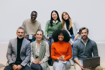 Diverse team sitting together in a casual office setting