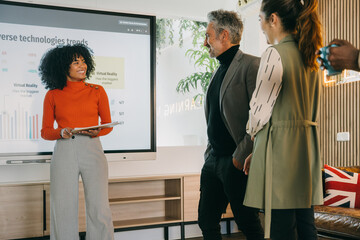 Diverse Team Analyzing Technology Trends Presentation