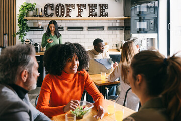 Diverse group of friends enjoying time at a coffee shop