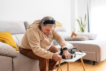 Woman preparing CPAP machine.