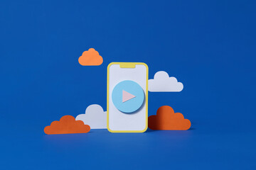 mobile phone with media icon and cloud on blue background