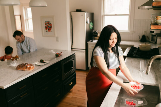 family with pregnant mother in kitchen 
