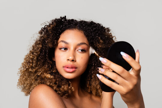 Woman putting on makeup
