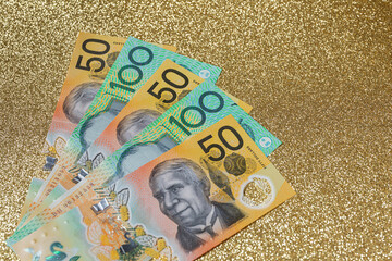 Fifty and one hundred Australian dollar bills in cash