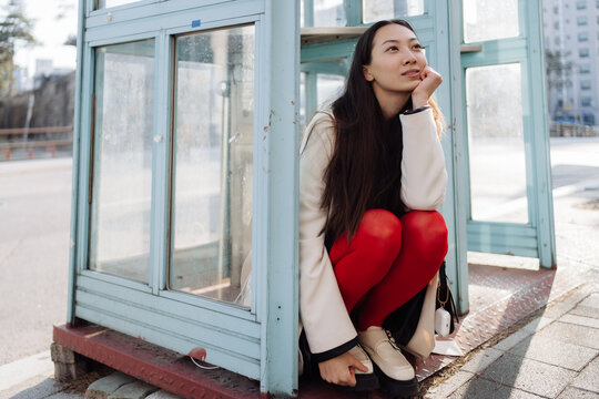 a single woman walks around a big city