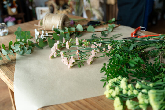 Florist workshop table with fresh flowers