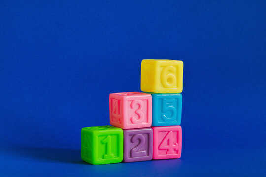 Сolorful plastic cubes with numbers lined up 