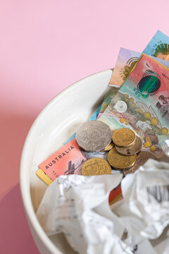 Australian money in coins and bills with shopping receipts