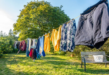 Washing drying on a washing line, catching the last of the day's sunshine.