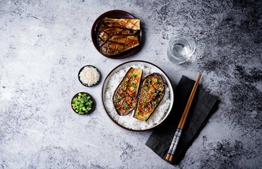 Teriyaki sauce eggplant slices with rice in a bowl