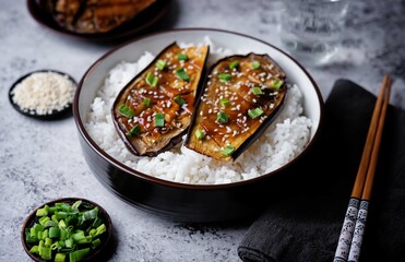 Teriyaki sauce eggplant slices with rice in a bowl