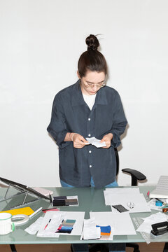 Woman Analyzing Receipts at Work