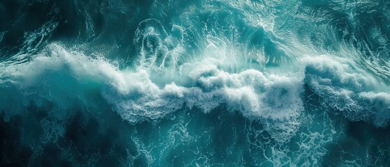 From above aerial view of turquoise ocean water with splashes and foam for abstract natural...