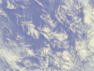 Fototapeta premium Blue sky background with fluffy feathery clouds